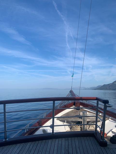 A boat view over calm waters.