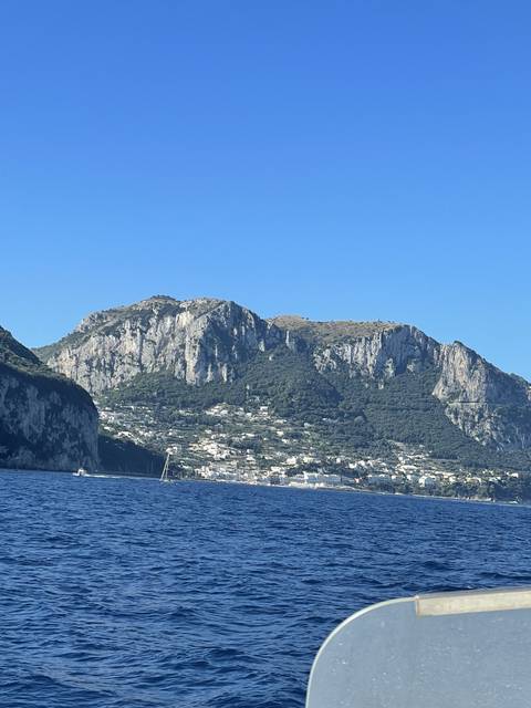      Coastal mountain landscape viewed from the sea.
  