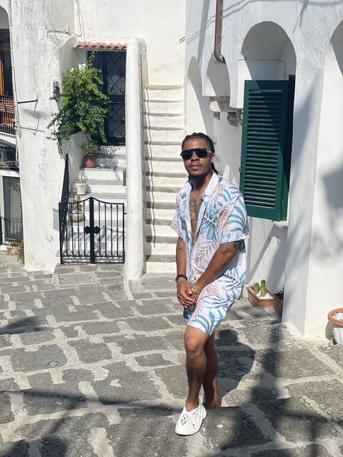 Person posing in a picturesque street.