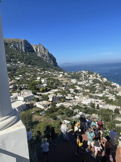       Overlooking a town set into coastal hills.
  