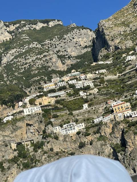       Town built into rocky coastal cliffs.
  