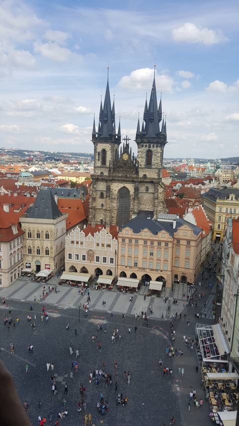 View of a bustling square with historic architecture.