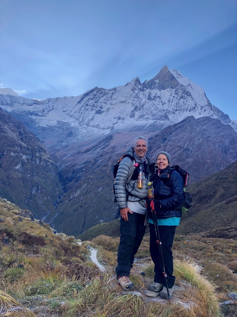 Couple posing with Annapurna mountain range in the background.