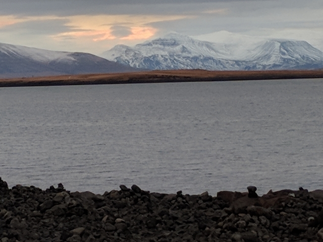       Lake with snow-capped mountains in the background.
  
