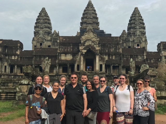 Group of people in front of Angkor Wat.