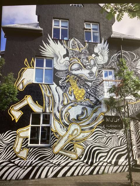 Building with intricate wall art featuring a dragon.