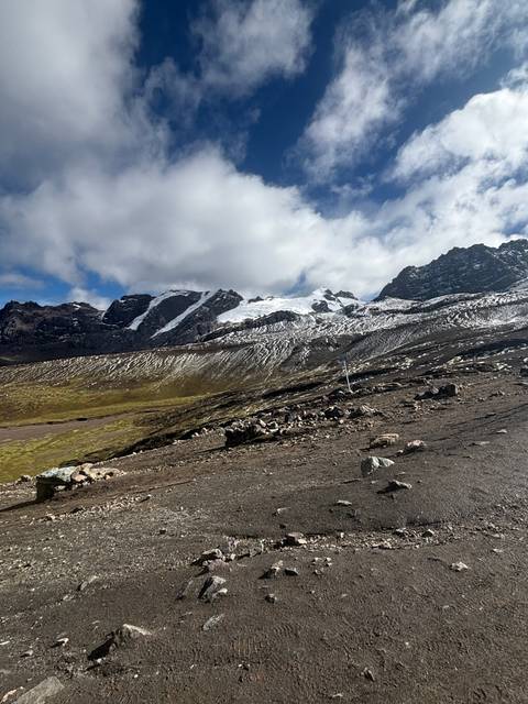 Snowy landscape with mountains and sky