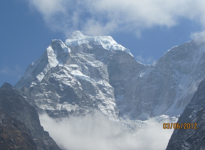       Close-up of a snowy mountain peak.
  
