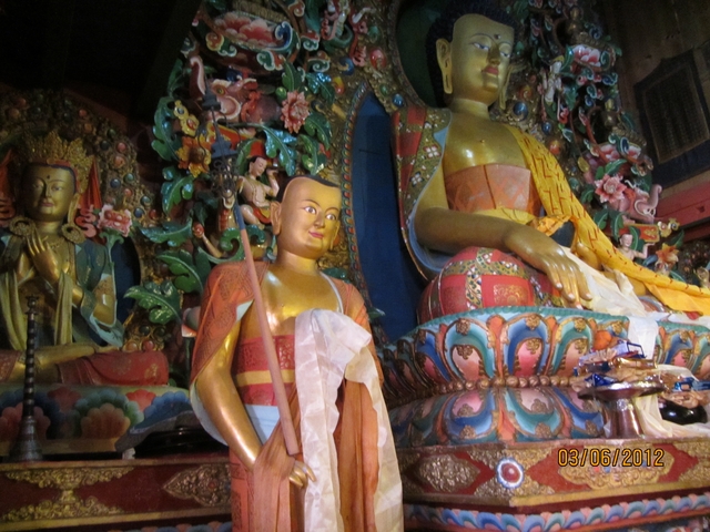       Colorful, intricate Buddhist statues.
  