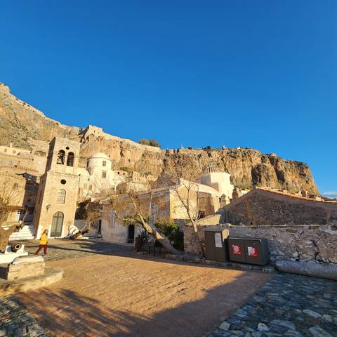       A hillside with historical structures.
  