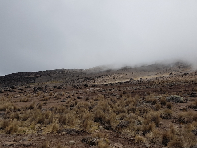 A rocky landscape with clouds.