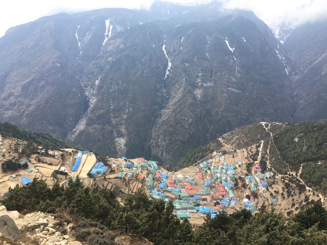 Aerial view of a village in the mountains.