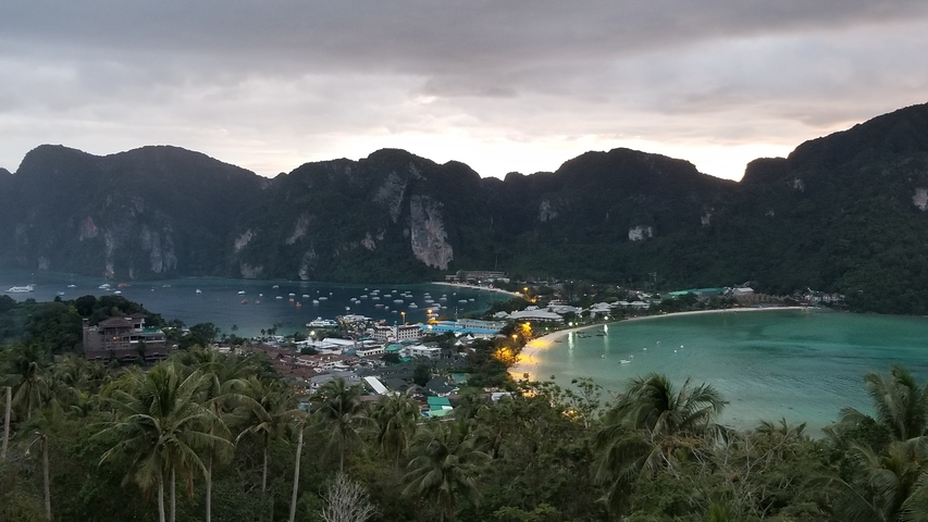 Scenic view of a beach in Ko Phi Phi with water and mountains.