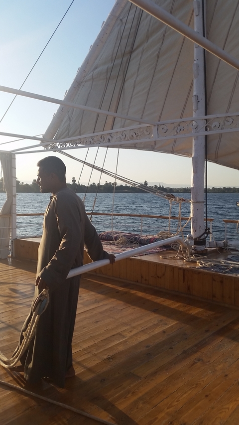 Person on a boat enjoying a sunny day.