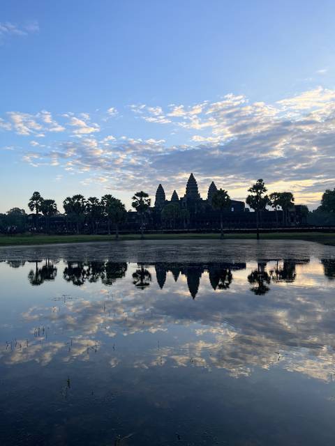       Reflection of a temple and sky in the water.
  