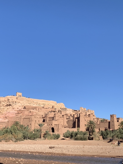 Clay-colored buildings under a clear sky.