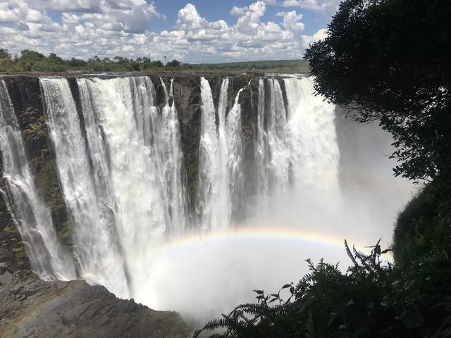 Victoria Falls with visible rainbow.