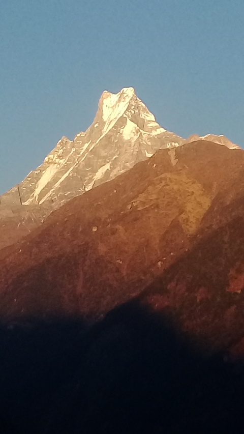 Close-up of a mountain slope with the sky in the background.