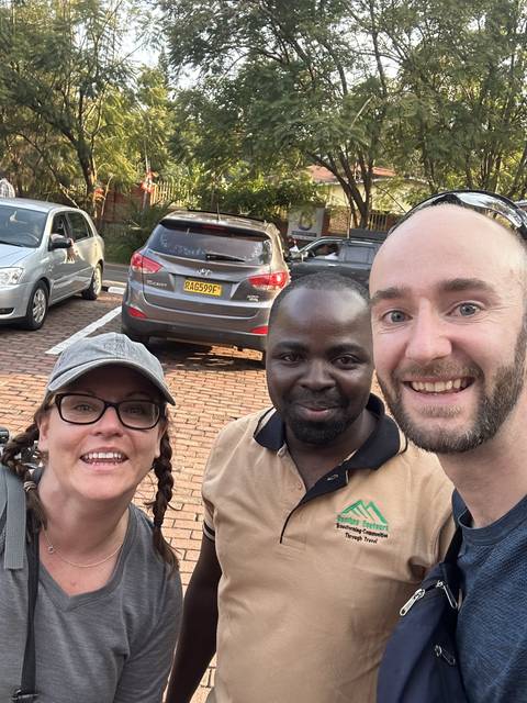       Three people posing for a selfie
  