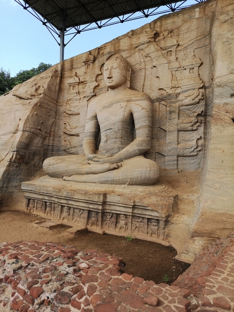       Close-up of a stone-carved Buddha statue.
  