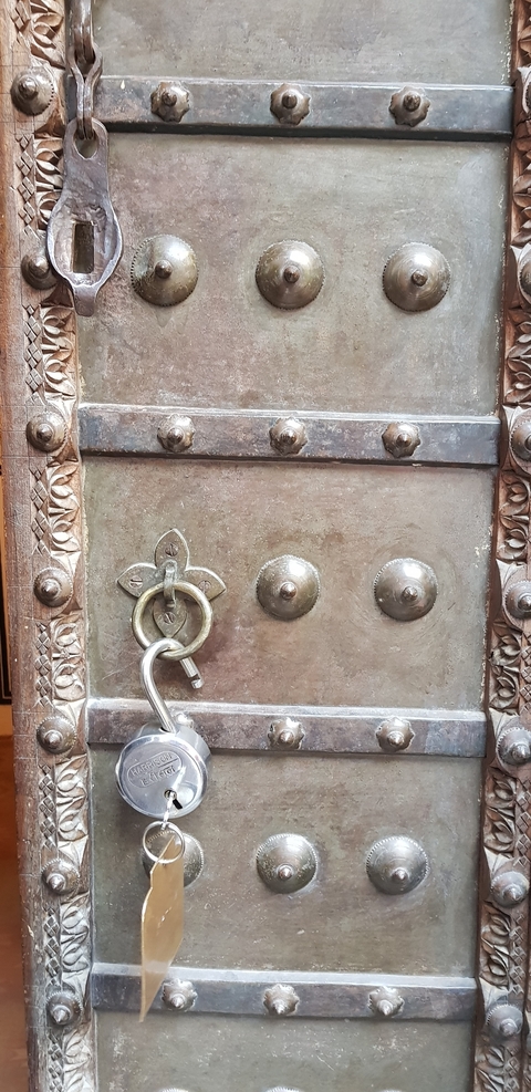 Close-up of an ornate metal door lock.