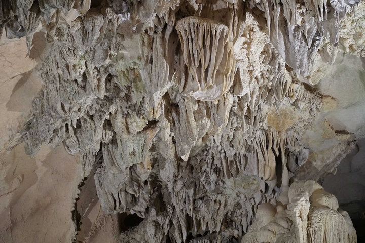 Close-up of cave stalactites and rock formations.
