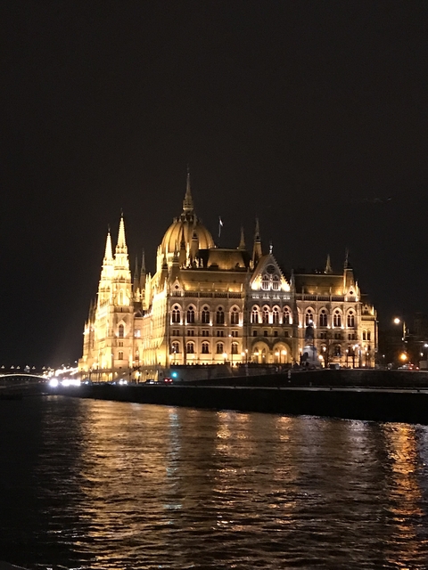 Majestic night view of the illuminated Hungarian Parliament Building.