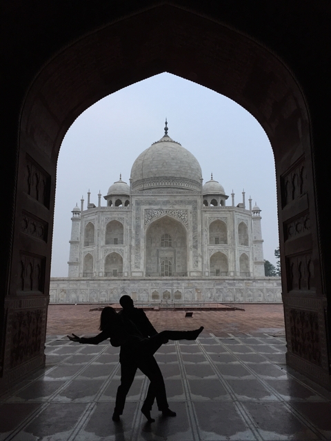 View of the Taj Mahal framed by an archway.