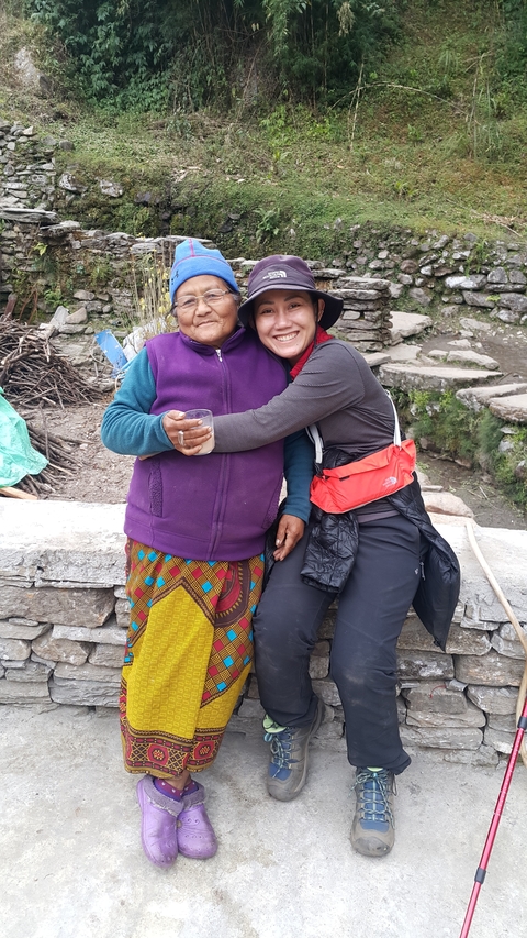 Two people embracing in an outdoor setting.