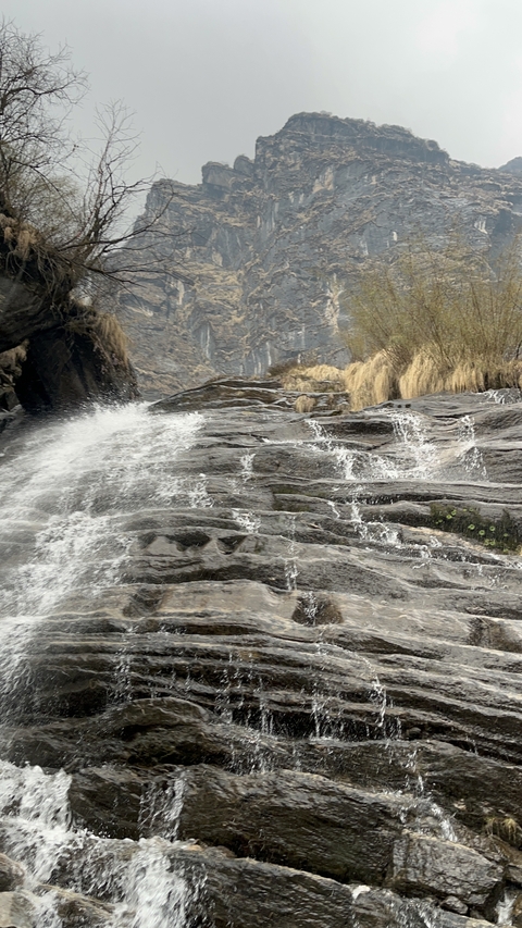 Water cascading down rocky steps.