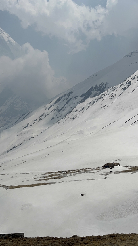 Snow-covered mountain slope during daytime.