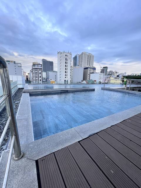       Rooftop swimming pool with city view
  