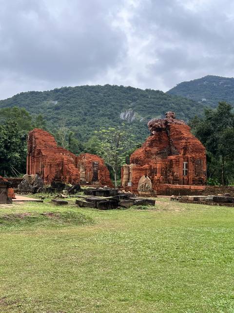 Historic brick ruins on a grassy field