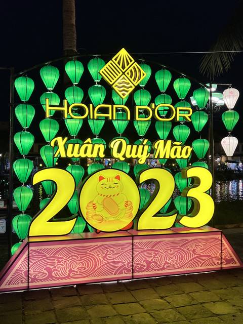 Illuminated festival sign at night