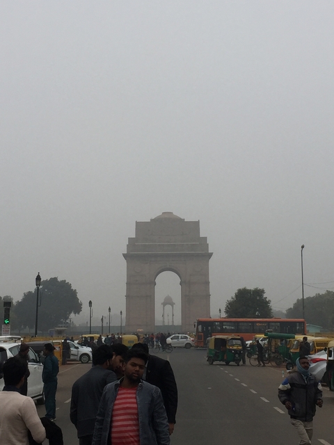       Large arch structure in a foggy setting.
  