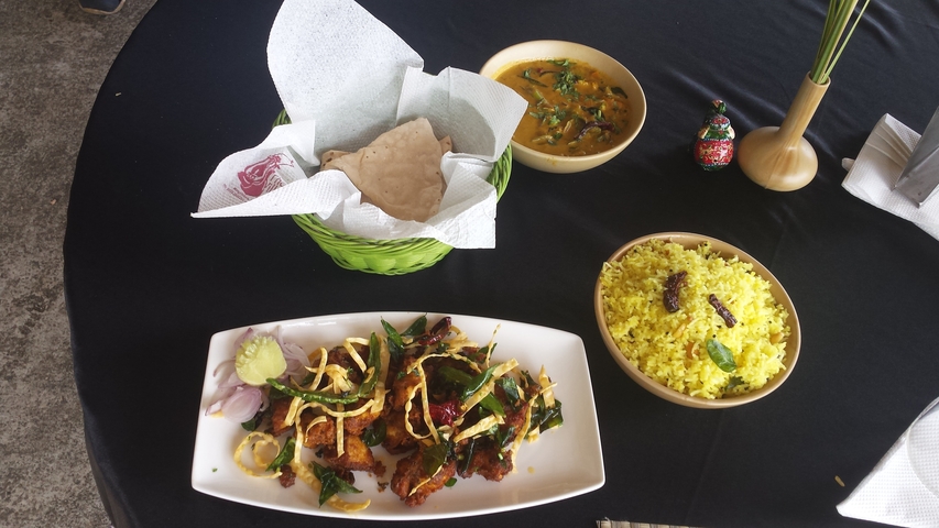       Assorted Indian dishes and rice on a table.
  