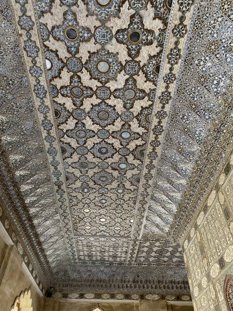       Detailed mosaics on a wall.
  
