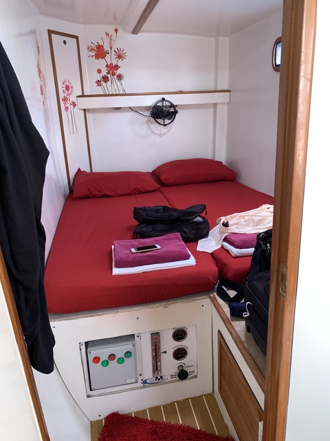 Bedroom with bunk beds and luggage.
