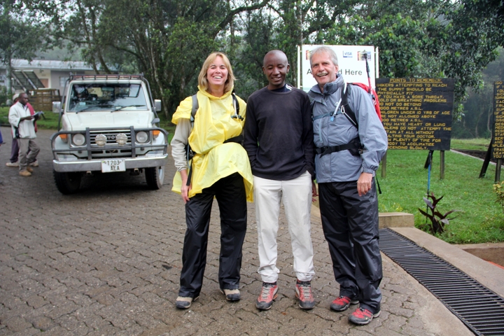 Group of hikers posing at the start of a trekking route.