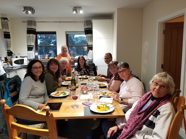 Group of people having dinner indoors