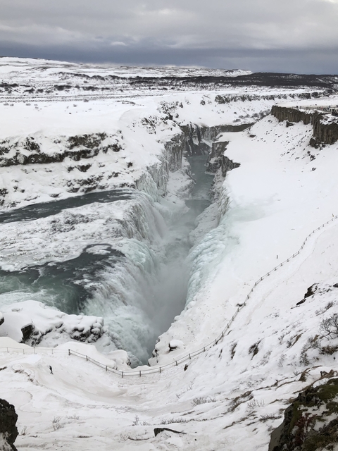       Frozen waterfall in a snowy landscape
  