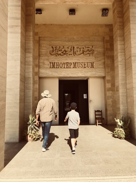       Two people entering Imhotep Museum.
  