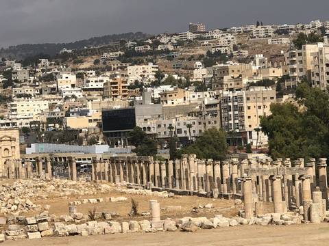 Ancient cityscape with columns and buildings.