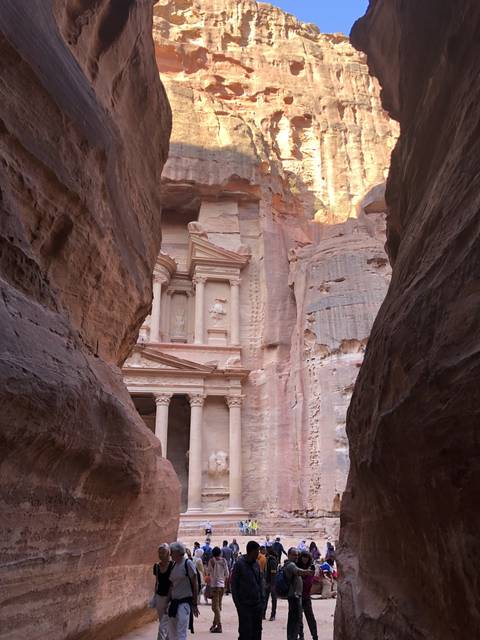 The Treasury at Petra seen through a narrow passage.