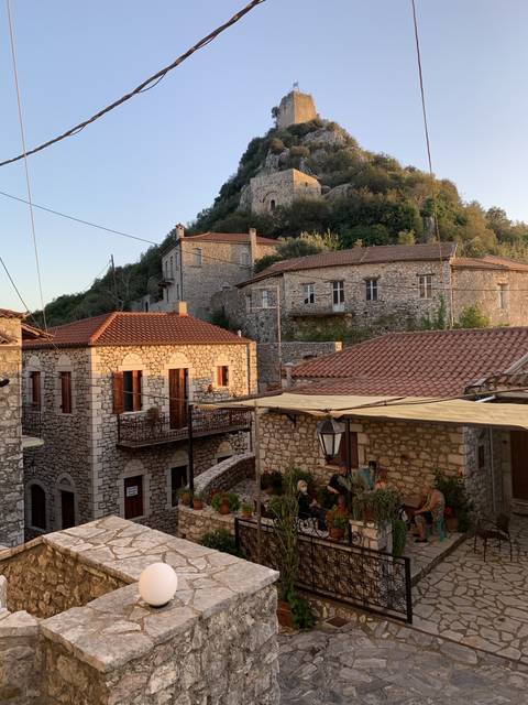       Scenic view of a stone village with an old tower.
  