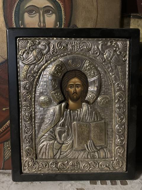       Orthodox religious icon on display, featuring Christ.
  