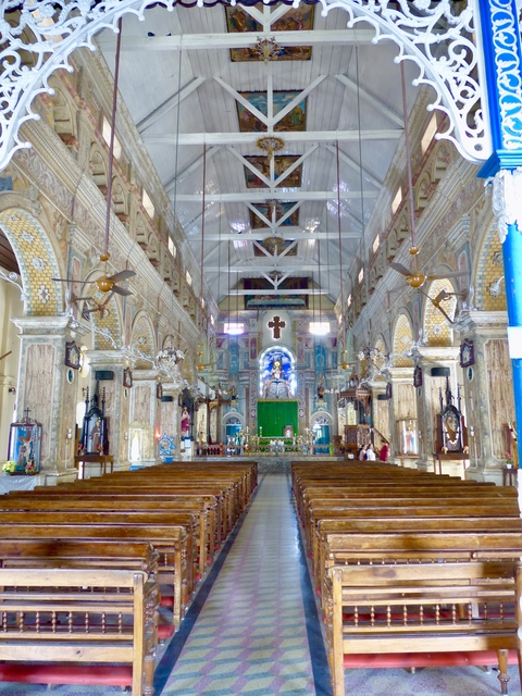      Interior of a church with detailed architecture and decor.
  