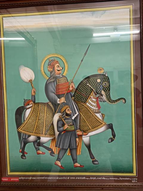 Painting depicting historical figures on an elephant.