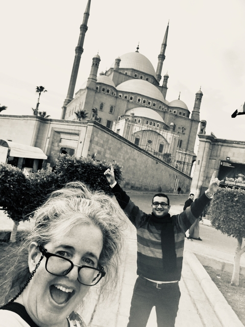       Selfie taken in front of a large historical mosque.
  