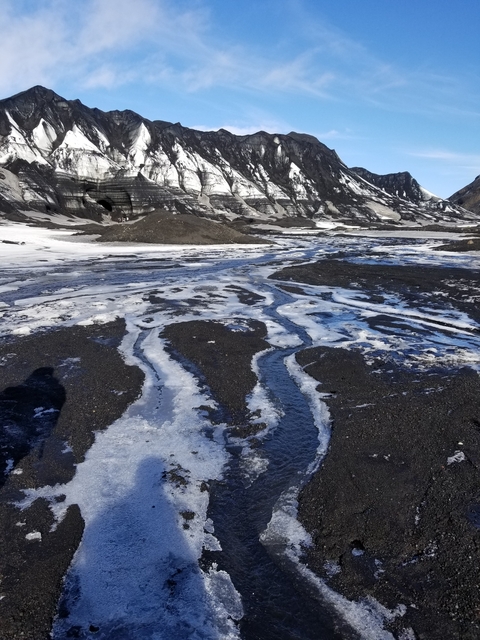 Volcanic landscape with ice and ash in Iceland.